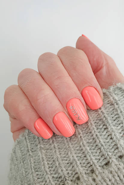 istock female hand nail beautiful manicure sweater 1251570719