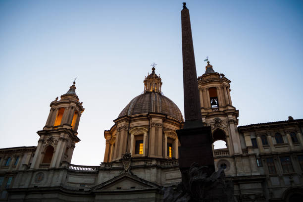 istock Church and Obelisk in Piazza Navona in Rome 1251572340