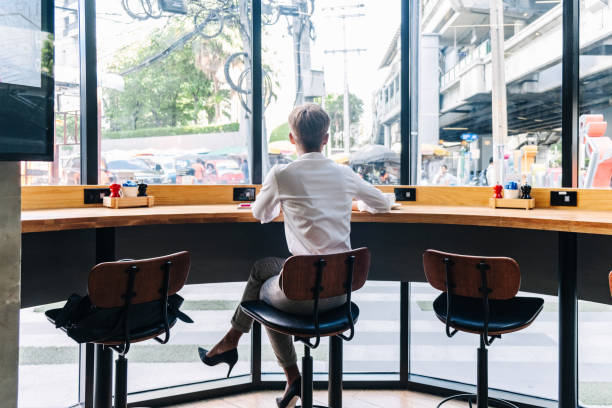 istock Back view of a business woman using laptop 1251572406
