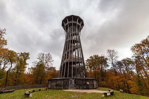 Close up view of Sauvabelin Tower (Tour de Sauvabelin) on cloudy autumn day, a wooden tower located in Sauvabelin forest with panoramic view of city, mountain, Lake Geneva, Lausanne, Vaud, Switzerland