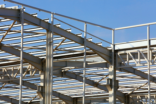 White colored metal scaffolding outside of building