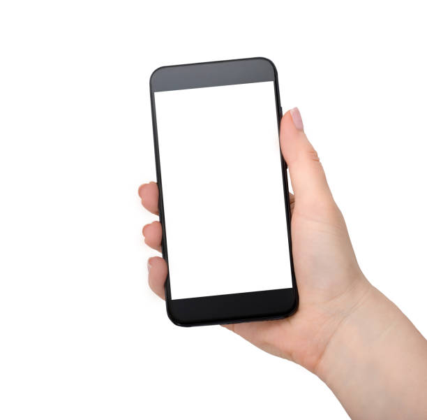 istock Woman hand holding black mobile phone isolated on white 1251576855