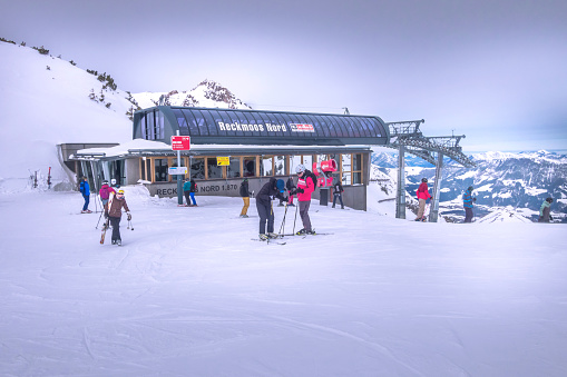 Saalbach-Hinterglemm, Austria - March, 5, 2020: Skiers and snowboarders ready for skiing from top ski lift station