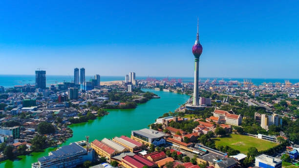 Background View of the Colombo city skyline with modern architecture buildi View of the Colombo city skyline with modern architecture buildings including the lotus towers. during sunset sri lanka business stock pictures, royalty-free photos & images