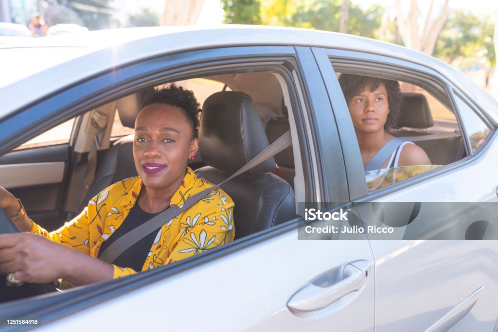 Portrait of a senior woman driving a car. Taxi app concept Portrait of a senior woman driving a car. Taxi app concept. Taxi Driver Stock Photo