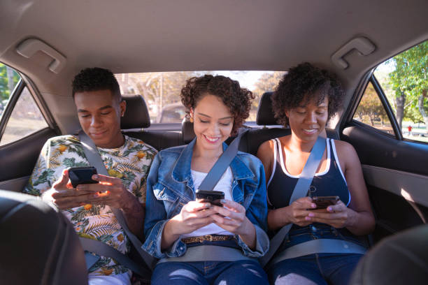 istock Young people pinned on cell phone screen during car ride 1251584969