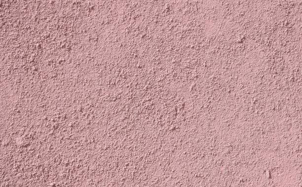 istock background: dark pink mustard concrete wall, colored stucco background texture 1251585658