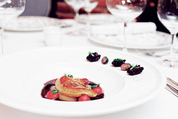 istock Foie gras with port sauce on table, toned 1251586830