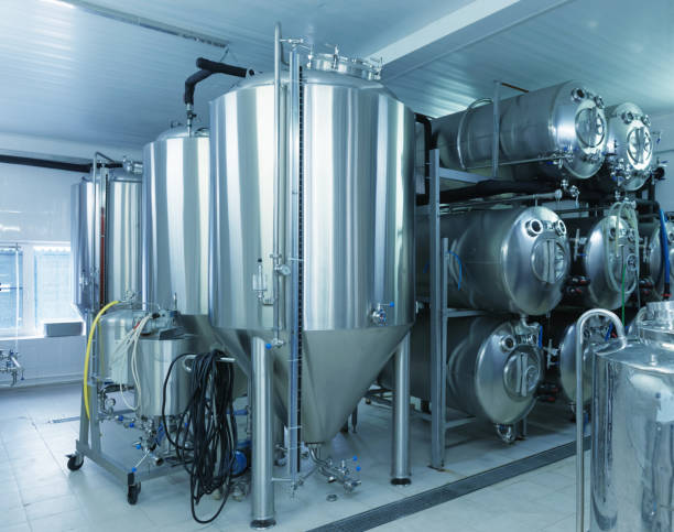 istock Beer storage tanks, food processing industry, toned 1251587025