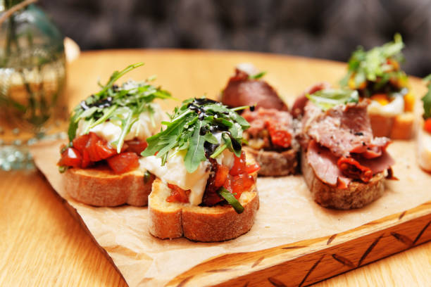 istock Bruschettas with beef, tomatoes and cheese, toned 1251587031