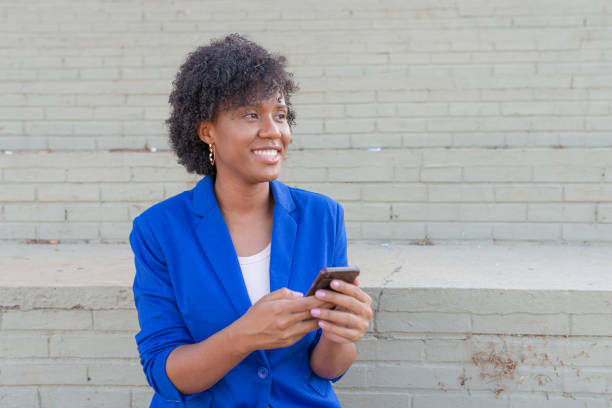 istock Businesswoman looking with cellphone in her hands 1251587878