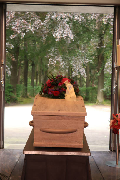 istock A coffin with a flower arrangement in a morgue 1251588335