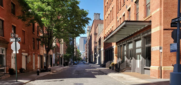 New York City - View of empty streets and sidewalks in the SoHo neighborhood of Manhattan during the 2020 coronavirus pandemic lockdown New York City - View of empty streets and sidewalks in the SoHo neighborhood of Manhattan during the 2020 coronavirus pandemic lockdown soho new york stock pictures, royalty-free photos & images