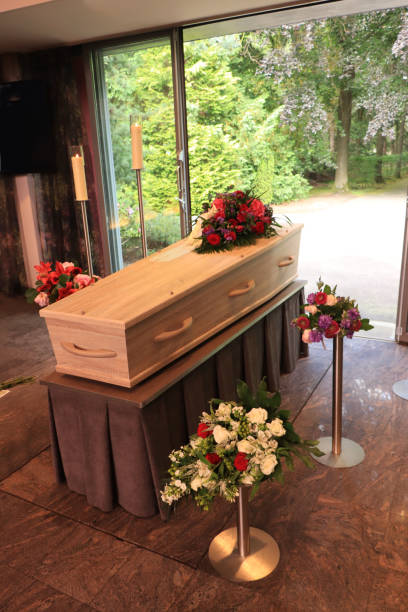 istock A coffin with a flower arrangement in a morgue 1251593183