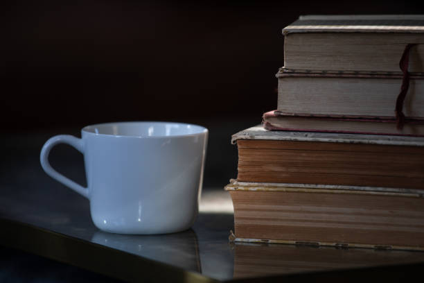 istock A stack of old books with a white cup next to it 1251596256