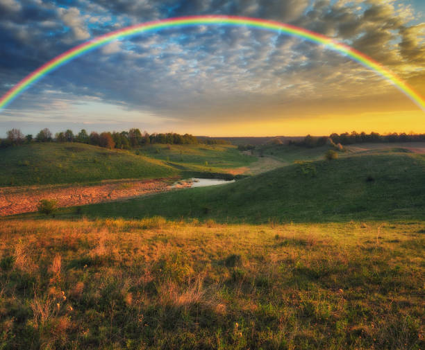 istock Rainbow over the meadow. picturesque spring morning 1251598531
