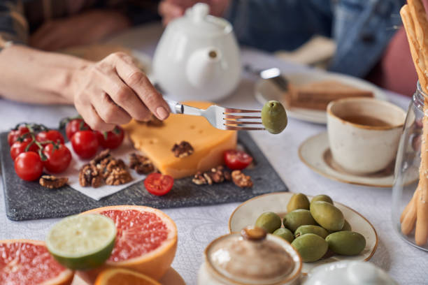 istock Couple eating tasty breakfast with hot drink 1251601524