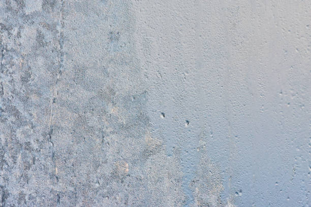 istock Ice texture on window, natural background , frozen glass 1251605093