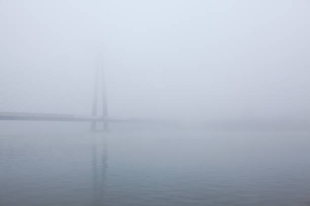 bridge over the river in the fog