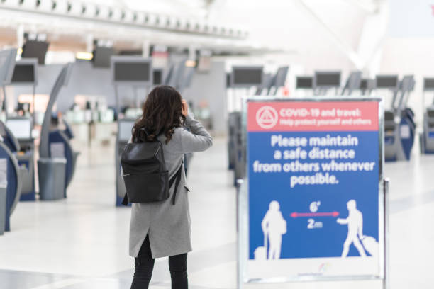 istock A woman walking through an empty airport 1251611758
