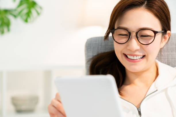 istock asian woman to see a tablet computer 1251620869