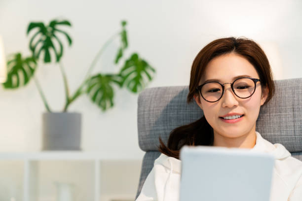 istock asian woman to see a tablet computer 1251620933