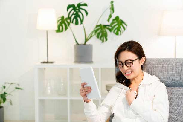 istock asian woman to see a tablet computer 1251620949
