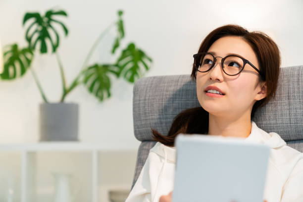 istock asian woman to see a tablet computer 1251620951