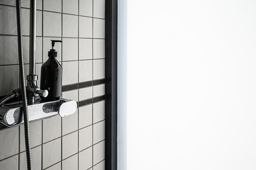 View of beautiful  modern bathroom  style with black soap bottle. Luxury interior design.