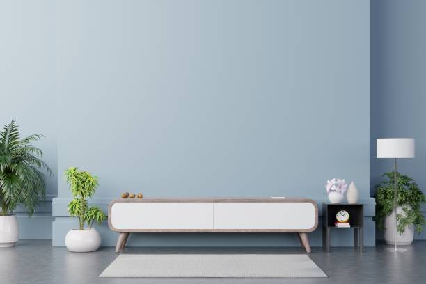 istock Tv cabinet in modern empty room on back dark wall background. 1251623183