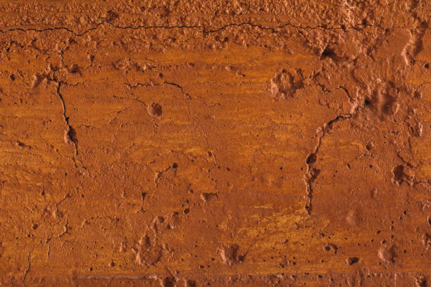 istock Traditional moroccan terracotta colored background. Orange or ocher clay wall texture. Painted shabby concrete. 1251632641
