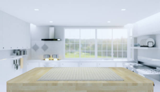 istock Wood countertop product display and blurred kitchen background. 1251636338