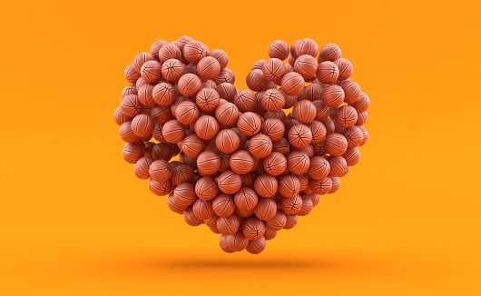 Heart gender shape made of basketball balls on orange background. 3d illustration