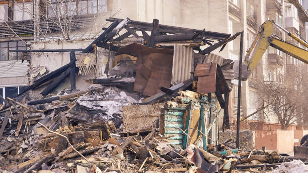 istock Demolition house using excavator in city. Rebuilding process. Remove equipment 1251644522