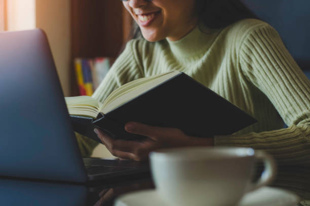 Woman hand holding book