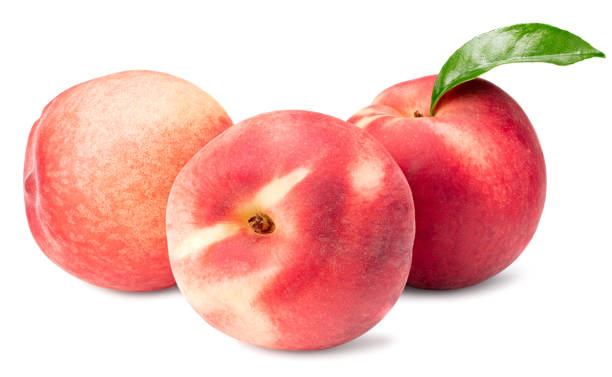 istock peach fruits with green leaf isolated on white background 1251656401