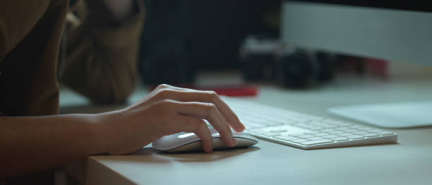 istock Female worker working with computer device on white office desk with camera and other supplies 1251656506