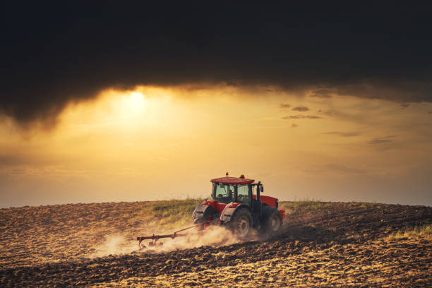 istock Tractor plowing the fields , agricultural landscape 1251657942