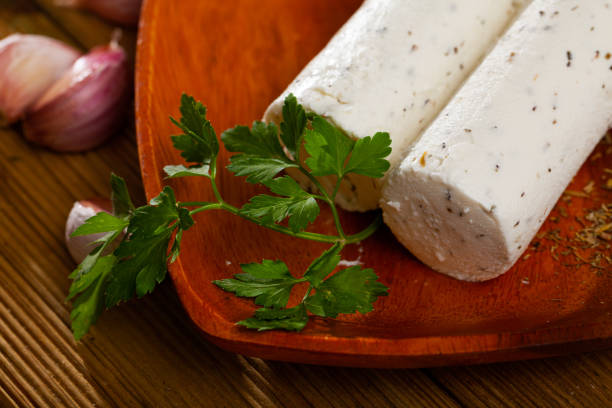 istock Soft goat cheese with herbs and garlic 1251664891