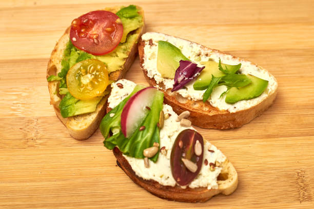 istock Ciabatta with cream cheese, avocado, various vegetables. Vegetarian sandwiches. 1251665215
