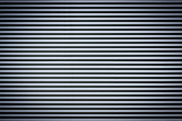 istock Corrugated metal sheet. New and Modern silver grey background pattern with nice vignetting. 1251666483