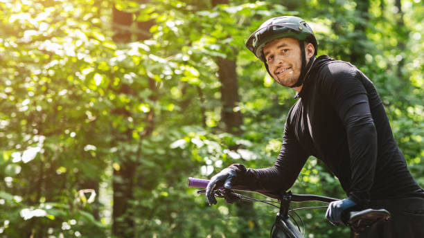 istock Portrait of young biker having break in forest 1251666599
