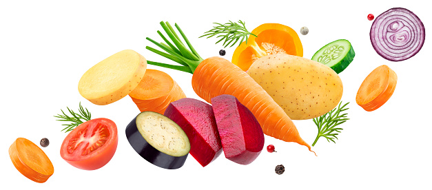 Falling mix of different vegetables, potatoes, cabbage, carrots, beets and onion with herbs and spices isolated on white background with clipping path