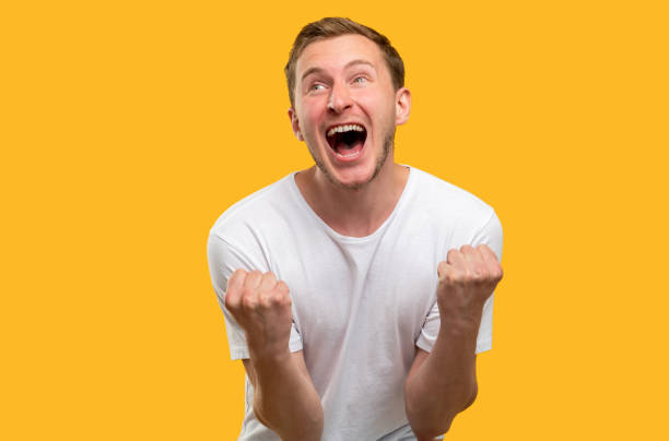 istock lucky man portrait victory gesture amused triumph 1251670819