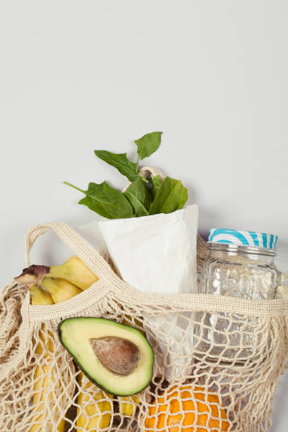 istock banana fruit, avocado, orange, spinach on gray background. 1251673173