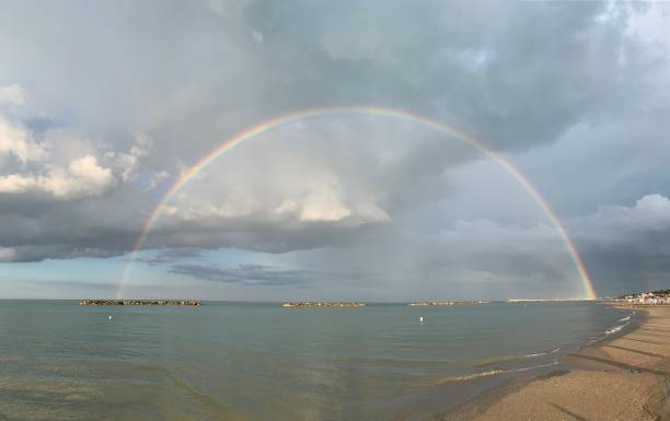 istock Rainbow in the middle of the sea 1251673386