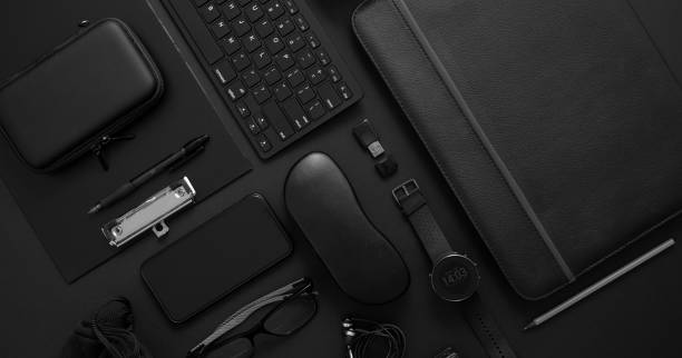istock Business concept. Flat lay composition with various black gadgets on dark black surface 1251674267