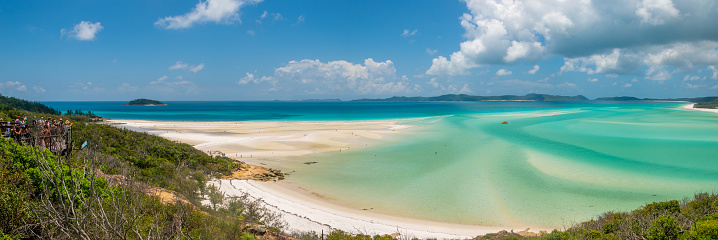 Whitsundays, Queensland, Australia - June 24th, 2020: A group of people admiring the view and taking pictures at the Whitsunday Island Lookout.