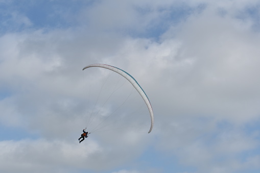 Paraglider's using updraft from the sea dunes to stay in the air
