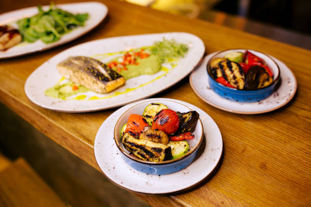 istock Cooked vegetables with salmon on background on restaurant table. 1251676541